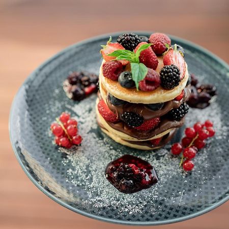 Hotel Address Istanbul Exterior foto A stack of pancakes with fruit